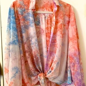 Large, pink and blue blouse.